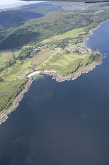Oblique aerial view of Carradale Golf Course and Carradale Pier, looking NW.