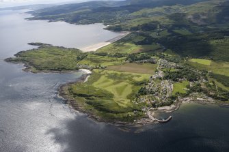 Oblique aerial view of Carradale Golf Course and Carradale Pier, looking SW.