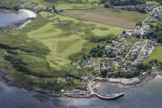 Oblique aerial view of Carradale Golf Course and Carradale Pier, looking SW.