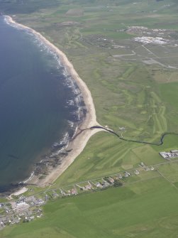 Oblique aerial view of Machrihanish Golf Course and Machrihanish village, looking NE.