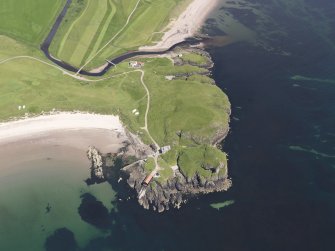 Oblique aerial view of Dunaverty Golf Course, Southend and Brunerican Bay, looking NE.