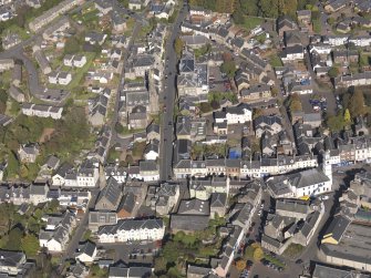General oblique aerial view of Lanark High Street centred on St Nicholas Church, taken from the S.