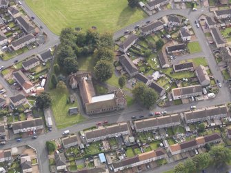 Oblique aerial view of Stenhouse and Carron Parish Church, taken from the N.