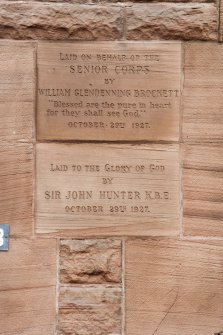 Detail of dedication stones on right side of door.