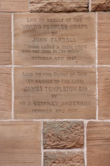 Detail of dedication stones on left side of door.