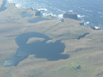 General oblique aerial view of Crosskirk Cemetey, Priesthoulland, looking SW.