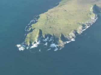 Oblique aerial view of the fort at Lambigarth and the field system on Ness of Gruting, looking SSE.