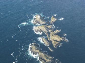 Oblique aerial view of North Unst Lighthouse, Muckle Flugga, Unst, looking NNE.