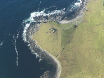 Oblique aerial view of Kirkaby Church, Westing, Unst, looking N.