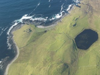 Oblique aerial view of Kirkaby Church, Westing, Unst, looking NNW.