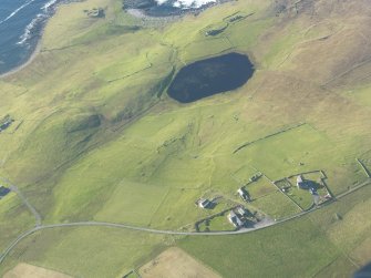 General oblique aerial view of Kirkaby Church, Newgord, Unst, looking N.