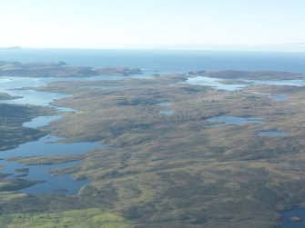General oblique aerial view of the moorland on West Mainland with Walls in the distance, looking S.