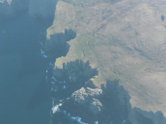 Oblique aerial view of Mu Ness, looking E.