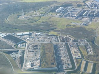 General oblique aerial view of Sullom Voe Oil Terminal, looking SSE.