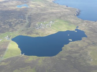 General oblique aerial view of Huxter and Loch of Huxter, looking NE.