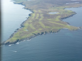 Oblique aerial view of Whalsay Golf Course with Skaw beyond, looking SW.