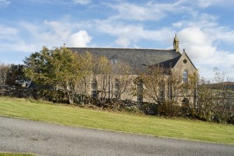 General view from the west looking to the side elevation of Aultbea Free Church from the manse grounds.