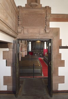 Interior. Entrance hall, view of doorway leading to nave