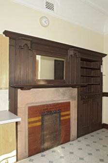 Interior. Kitchen, view of fireplace and press fitting