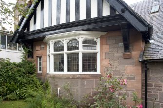 Detail of bay window set into half timbered gable