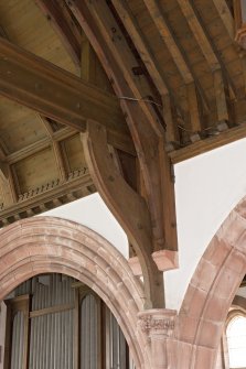 Interior. Detail of roof truss and corbels