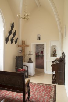 Ground floor. Chapel to west of entrance hall from east.