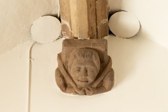 1st floor mezzanine. 'Solar'/ library. Detail of carved stone head corbel.