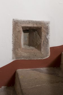 Ground floor. Staircase. Detail of gunloop window on internal wall.