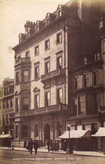 View of Conservative Club, 112 Princes Street, Edinburgh from south east showing figures and neighbouring shops of McNab & Shepherd and Phin. 
Titled:  'Conservative Club, Princes Street, Edinburgh. 3845. G.W.W.'
Photograph Album 195  Photographs by G W Wilson & Co
Blue leatherbound album