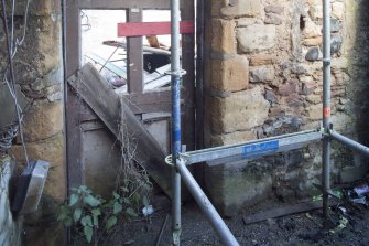View of stonework within wall of former building abutting to the SE at rear of 31 High Street.