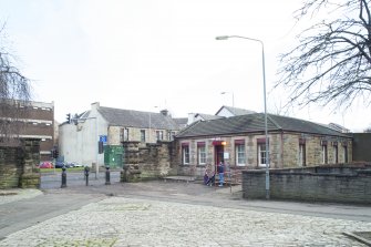 General view of the gate piers and gate house within the perimeter walls of the former Maryhill Barracks site, taken from the north west.