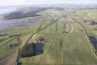 Oblique aerial view of the archaeological evaluation trenches in advance of the A75 Dunragit Bypass construction.