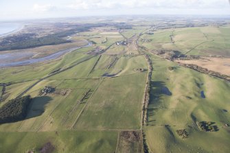 Oblique aerial view of the archaeological evaluation trenches in advance of the A75 Dunragit Bypass construction.