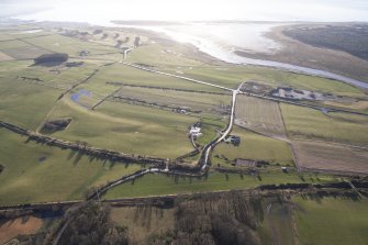 Oblique aerial view of the archaeological evaluation trenches in advance of the A75 Dunragit Bypass construction.