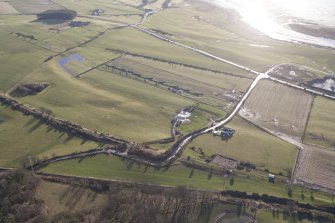 Oblique aerial view of the archaeological evaluation trenches in advance of the A75 Dunragit Bypass construction.