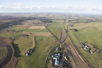 Oblique aerial view of the archaeological evaluation trenches in advance of the A75 Dunragit Bypass construction.