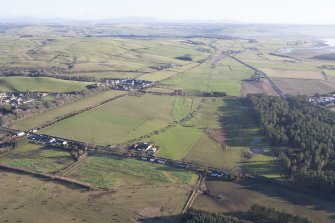 Oblique aerial view of the archaeological evaluation trenches in advance of the A75 Dunragit Bypass construction.