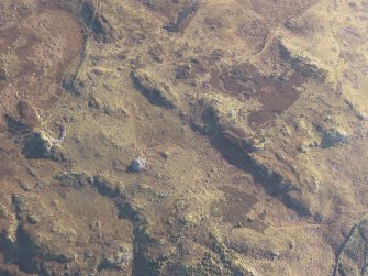 Oblique aerial view centred on Green House Bridge cairn, the hut-circles and small cairns, looking ESE.
