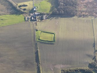 Oblique aerial view of Rispain Camp and Rispain farmstead, looking SSE.