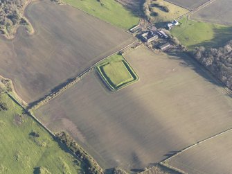 Oblique aerial view of Rispain Camp and Rispain farmstead, looking ENE.