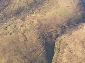 Oblique aerial view of the Roman Road and quarry pits at Raggen Hill, looking W.