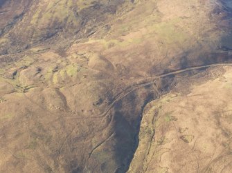 Oblique aerial view of the Roman Road and quarry pits at Raggen Hill, looking WSW.