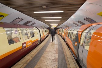 Interior. View looking along the island platform of Bridge Street subway station, with trains at both outer and inner circle platforms