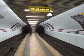 Interior. View looking along the island platform of Bridge Street subway station, towards the tunnel openings and fire exit entrances to tunnels