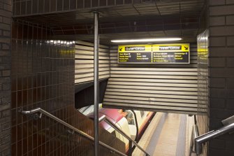 Interior. View looking down staircase leading to platform level within Bridge Street subway station