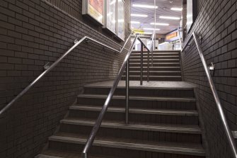 Interior. View looking up staircase linking platform and concourse levels within Bridge Street subway station