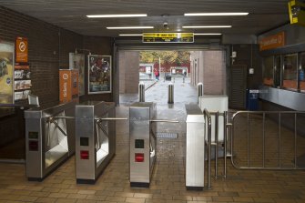 Interior. View looking back across concourse of Bridge Street subway station, towards turnstiles, ticket office and main entrance