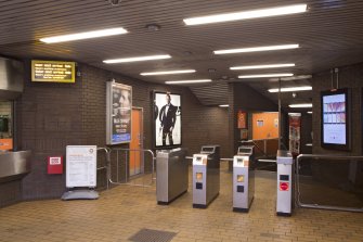 Interior. View across concourse of Bridge Street subway station, towards turnstiles and staircase leading to platform level.