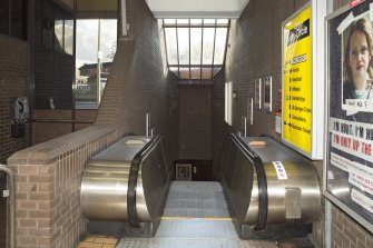 Interior view at concourse level of escalator leading down to platforms of Govan Cross Subway Station, 771-5 Govan Road, Glasgow.