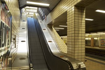 Interior view looking up escalator linking platform and escalator levels within Govan Cross Subway Station, 771-5 Govan Road, Glasgow.